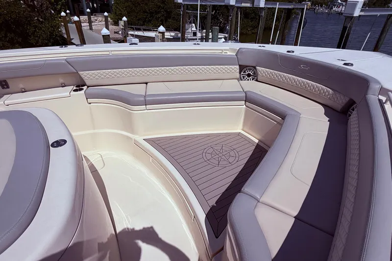  Yacht Photos Pics Luxurious seating area on 2022 Scout 425 LXF boat, featuring elegant upholstery and spacious design.
