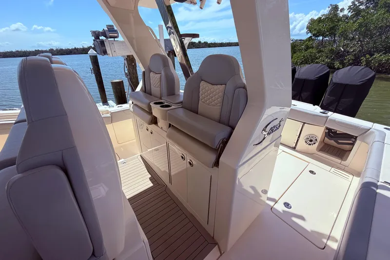  Yacht Photos Pics 2022 Scout 425 LXF boat interior with luxurious seating and scenic water view.