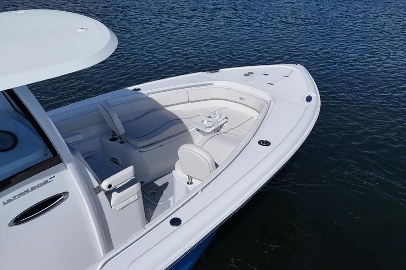  Yacht Photos Pics 2023 Sea Hunt Ultra 305 SE boat on water, featuring spacious seating and sleek design.