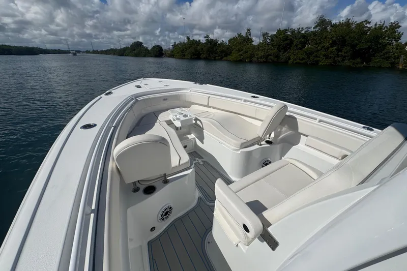  Yacht Photos Pics 2023 Sea Hunt Ultra 305 SE boat interior with white seating and open water view.