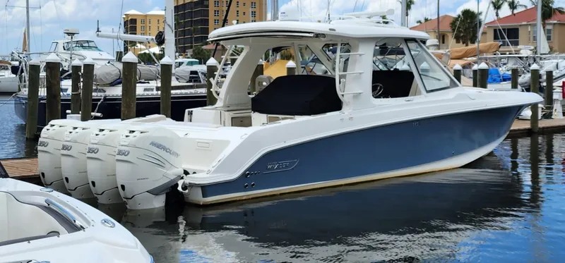  Yacht Photos Pics 2019 Boston Whaler 380 Realm boat docked at marina with multiple outboard engines.