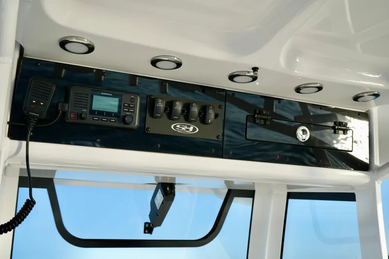 No Name 2024 30 Sea Hunt Yacht Photos Pics 2024 Sea Hunt 305 Ultra boat dashboard with controls and radio equipment.