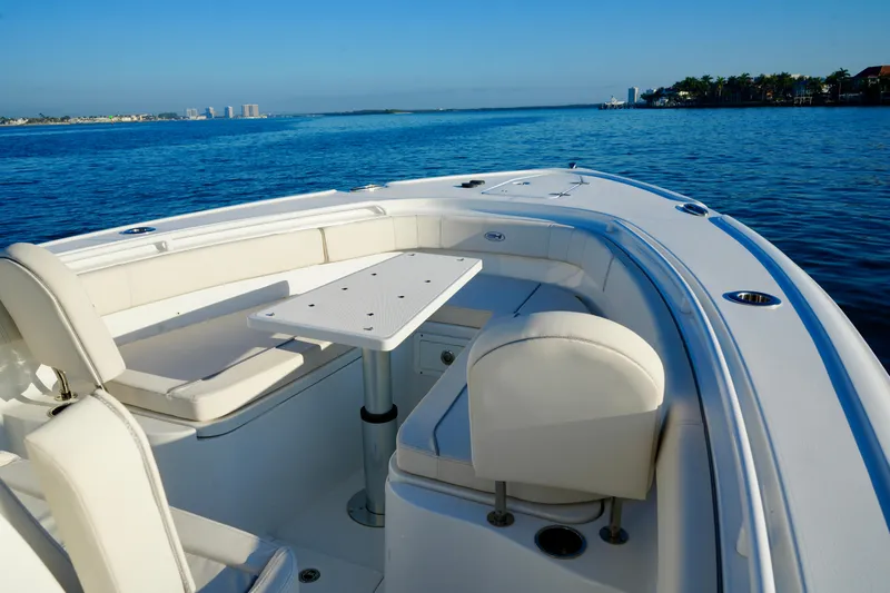 No Name 2024 30 Sea Hunt Yacht Photos Pics 2024 Sea Hunt 305 Ultra boat with seating and table on calm water.