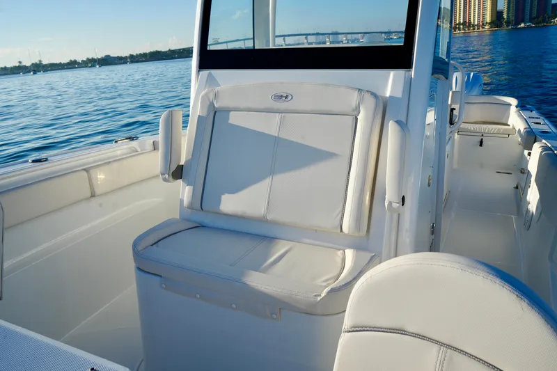 No Name 2024 30 Sea Hunt Yacht Photos Pics 2024 Sea Hunt 305 Ultra boat interior with seating, on calm water.