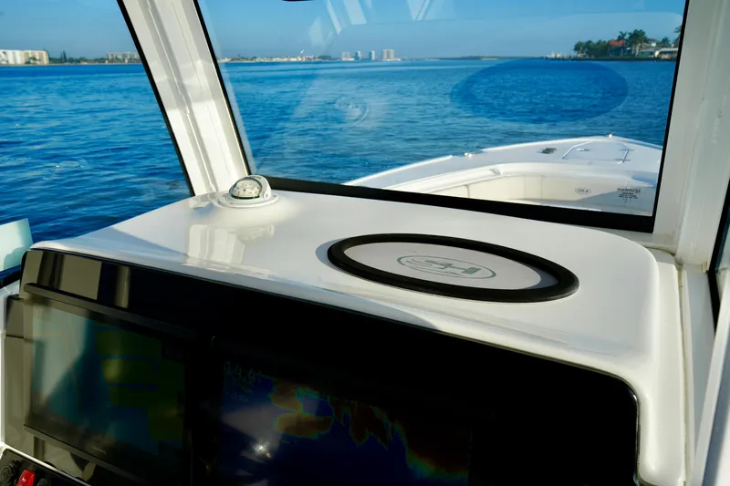 No Name 2024 30 Sea Hunt Yacht Photos Pics 2024 Sea Hunt 305 Ultra boat dashboard with ocean view in the background.