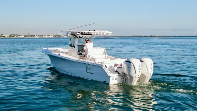 No Name 2024 30 Sea Hunt Yacht Photos Pics 2024 Sea Hunt 305 Ultra boat cruising on calm waters.