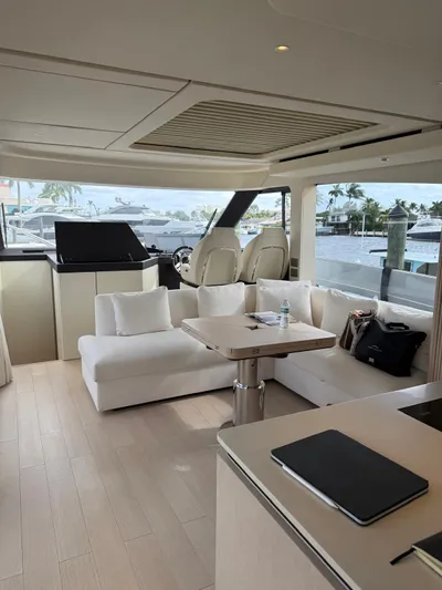  Yacht Photos Pics Luxurious interior of 2025 Azimut Seadeck 6 yacht with modern seating and helm.