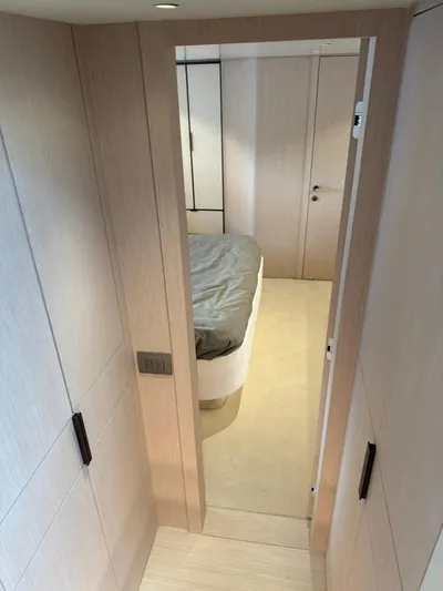  Yacht Photos Pics 2025 Azimut Seadeck 6 yacht interior, featuring a modern bedroom with sleek wood paneling.