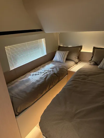  Yacht Photos Pics Interior of 2025 Azimut Seadeck 6 yacht with cozy twin beds and modern design.
