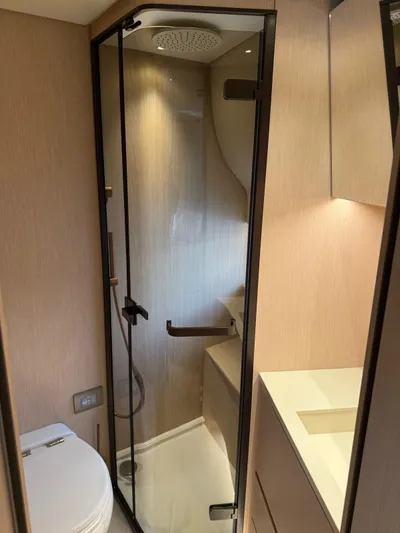  Yacht Photos Pics Modern bathroom in 2025 Azimut Seadeck 6 yacht with glass shower and sleek design.
