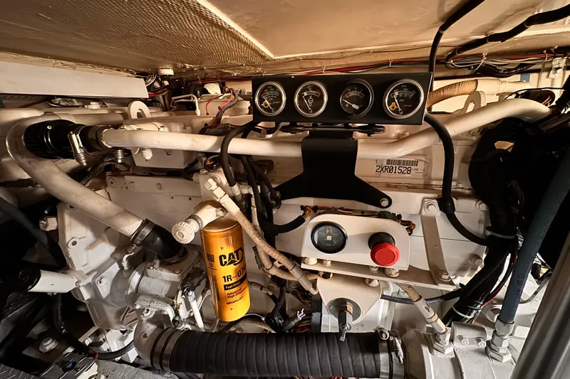 Benyara Yacht Photos Pics Engine room of a 1999 Ocean Yachts 48 Super Sport with gauges and CAT filter.