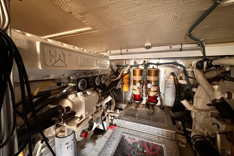 Benyara Yacht Photos Pics Engine room of 1999 Ocean Yachts 48 Super Sport with CAT Marine Power engine.