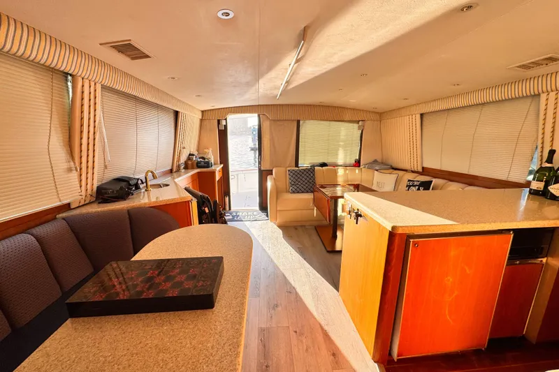 Benyara Yacht Photos Pics Luxurious interior of a 1999 Ocean Yachts 48 Super Sport, featuring elegant seating and modern amenities.