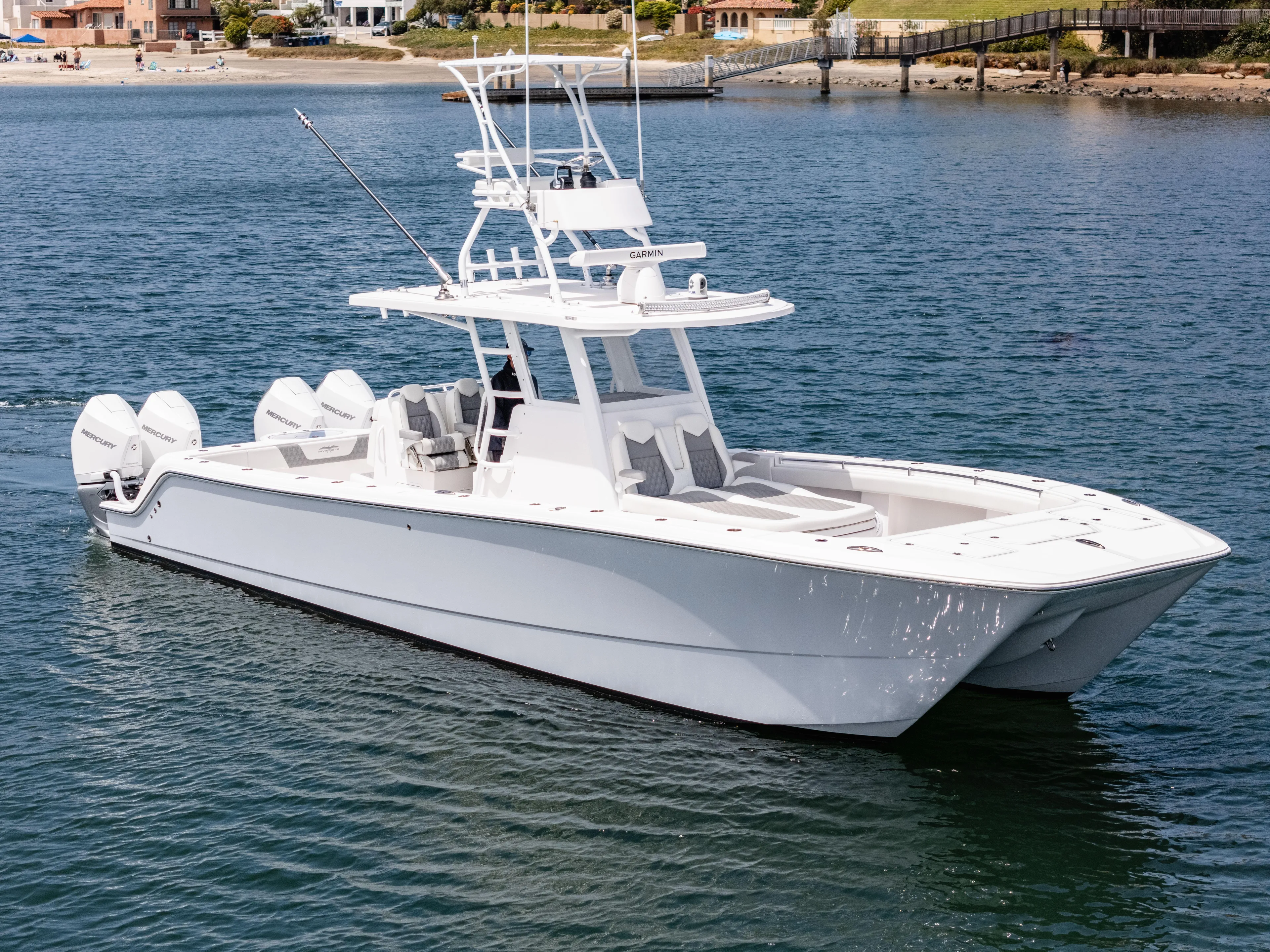  Yacht Photos Pics 2024 Invincible 35 Catamaran on water, showcasing sleek design and powerful engines.