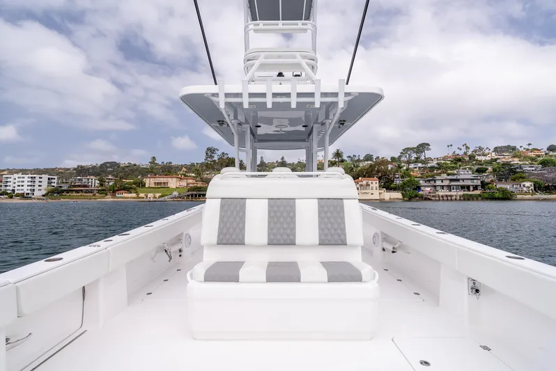  Yacht Photos Pics 2024 Invincible 35 Catamaran on water, showcasing sleek design and comfortable seating.