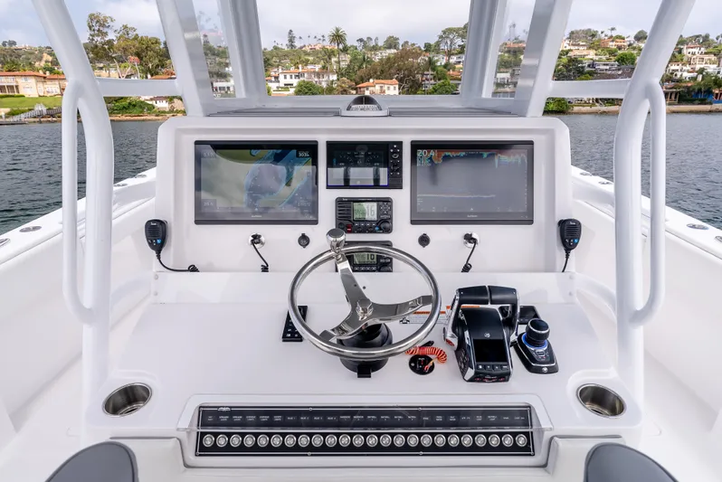  Yacht Photos Pics 2024 Invincible 35 Catamaran helm with advanced navigation displays and controls.