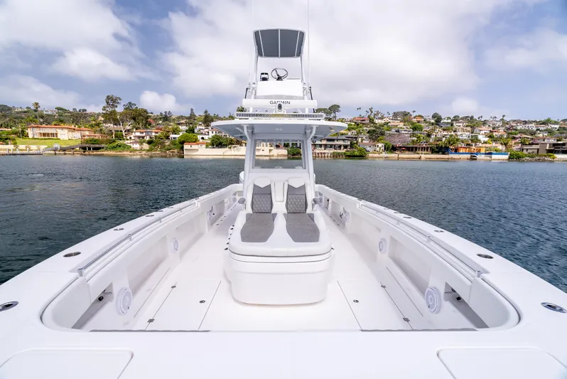  Yacht Photos Pics 2024 Invincible 35 Catamaran on calm water, showcasing spacious deck and modern design.