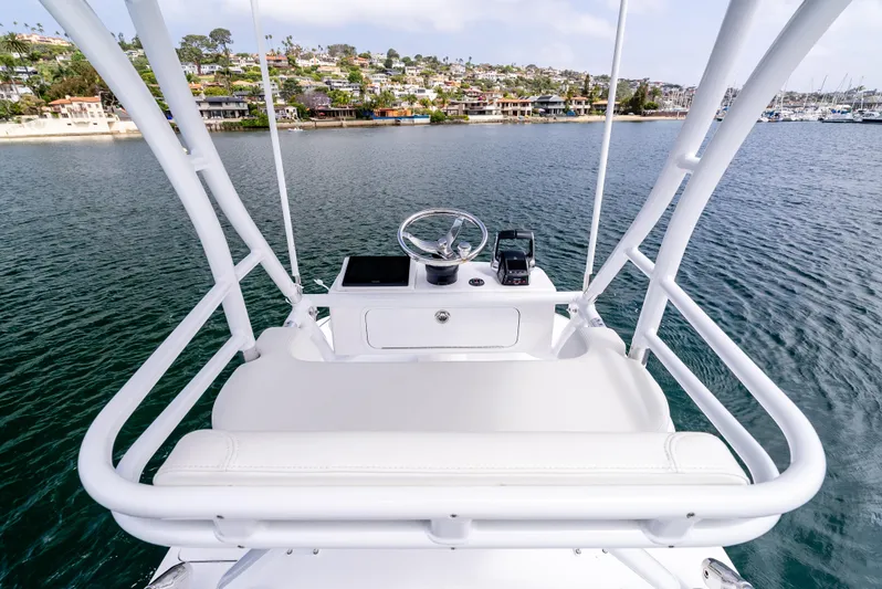  Yacht Photos Pics 2024 Invincible 35 Catamaran helm with scenic waterfront view.