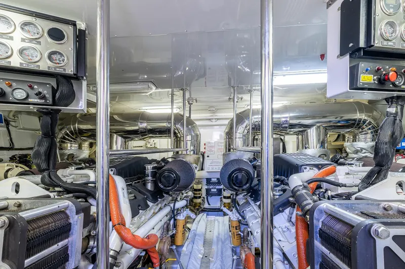 Easy Yacht Photos Pics Engine room of 2009 Sanlorenzo 82 yacht, featuring dual engines and control panels.