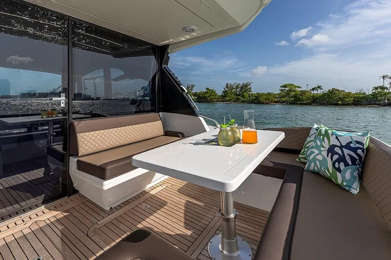  Yacht Photos Pics Luxurious 2023 Galeon 425 HTS yacht interior with elegant seating and scenic water view.
