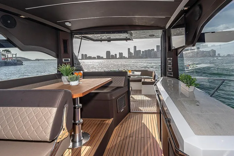  Yacht Photos Pics Luxurious interior of 2023 Galeon 425 HTS yacht with city skyline view.