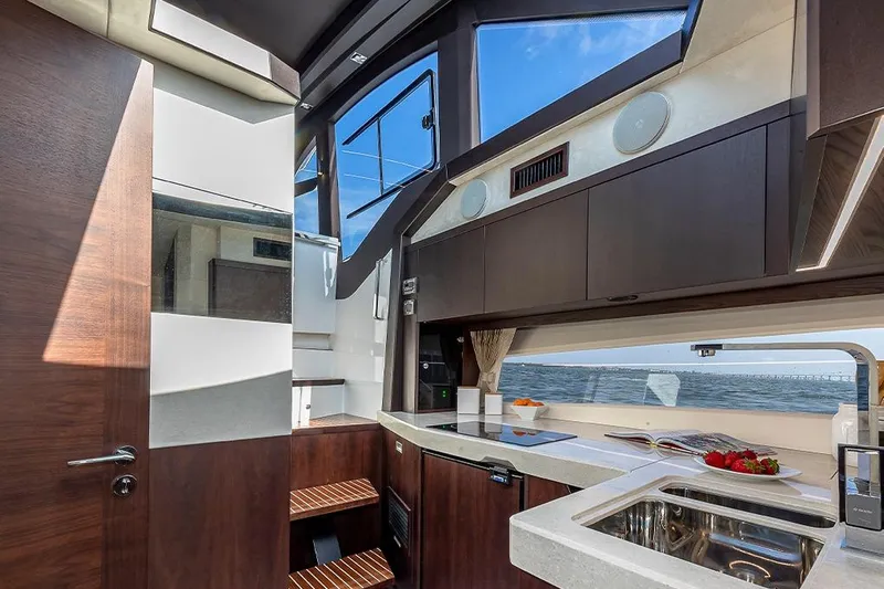  Yacht Photos Pics Luxurious interior of 2023 Galeon 425 HTS yacht with modern kitchen and ocean view.