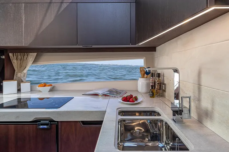  Yacht Photos Pics Luxurious 2023 Galeon 425 HTS yacht kitchen with sea view, modern appliances, and elegant design.