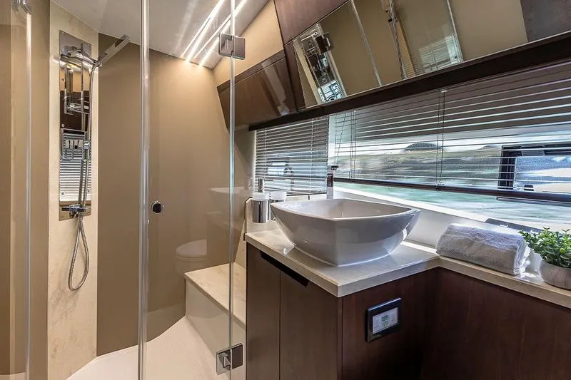  Yacht Photos Pics Luxurious bathroom interior of 2023 Galeon 425 HTS yacht with modern fixtures and elegant design.