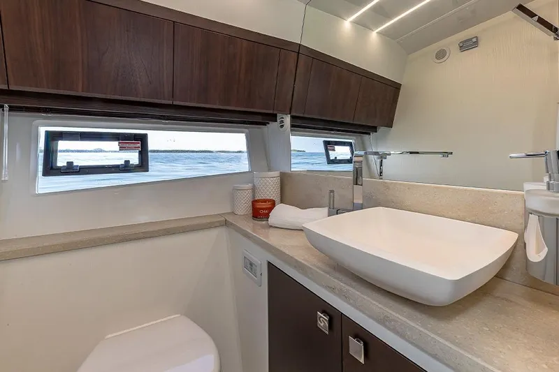  Yacht Photos Pics Luxurious bathroom interior of 2023 Galeon 425 HTS yacht with modern fixtures.