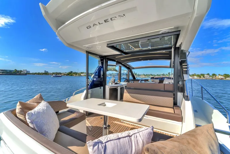  Yacht Photos Pics Galeon 425 HTS 2023 yacht on calm waters with luxurious interior.