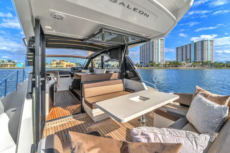  Yacht Photos Pics 2023 Galeon 425 HTS yacht interior with luxurious seating and waterfront view.