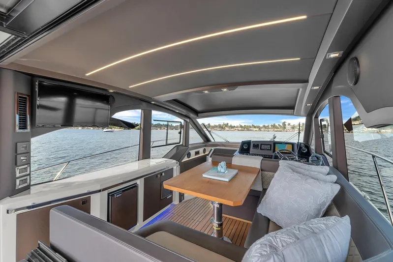  Yacht Photos Pics Luxurious interior of 2023 Galeon 425 HTS yacht with modern seating and scenic water view.