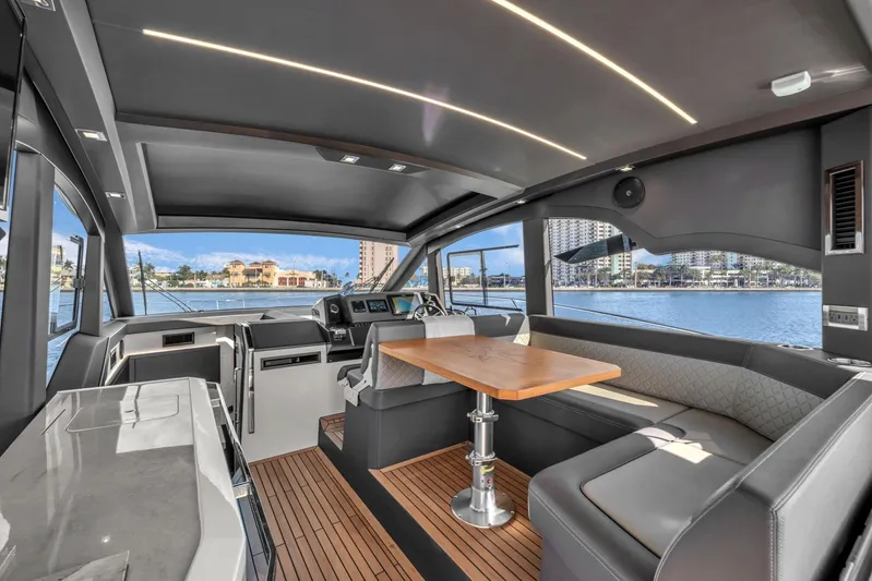  Yacht Photos Pics Luxurious interior of 2023 Galeon 425 HTS yacht with modern seating and panoramic windows.