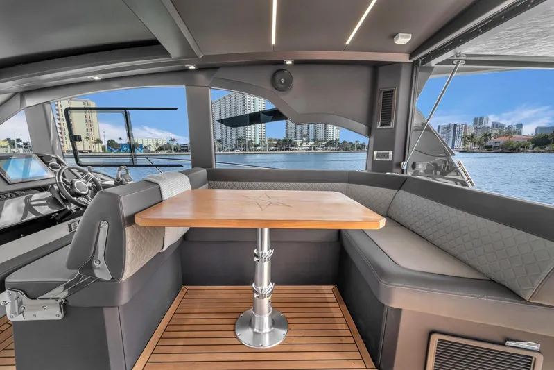  Yacht Photos Pics Interior of 2023 Galeon 425 HTS yacht with elegant seating and waterfront view.