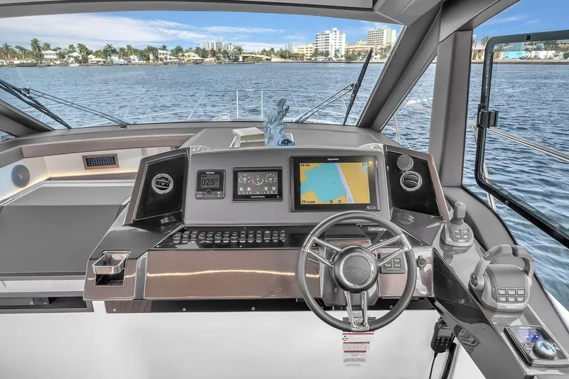  Yacht Photos Pics 2023 Galeon 425 HTS yacht helm with advanced navigation system and waterfront view.