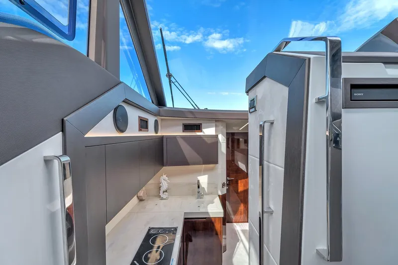  Yacht Photos Pics Modern kitchen interior of 2023 Galeon 425 HTS yacht with sleek design and appliances.