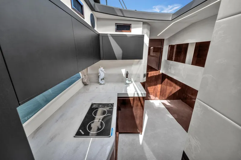  Yacht Photos Pics Modern kitchen interior of 2023 Galeon 425 HTS yacht with sleek design and appliances.