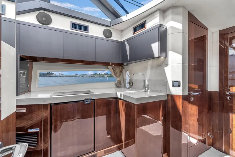  Yacht Photos Pics Luxurious interior of 2023 Galeon 425 HTS yacht with modern kitchen design.