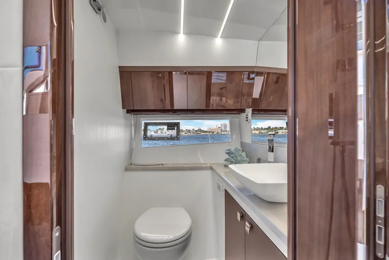  Yacht Photos Pics Luxurious bathroom interior of 2023 Galeon 425 HTS yacht with modern fixtures and ocean view.