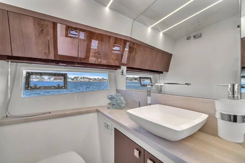  Yacht Photos Pics Luxurious bathroom interior of 2023 Galeon 425 HTS yacht with modern fixtures and ocean view.