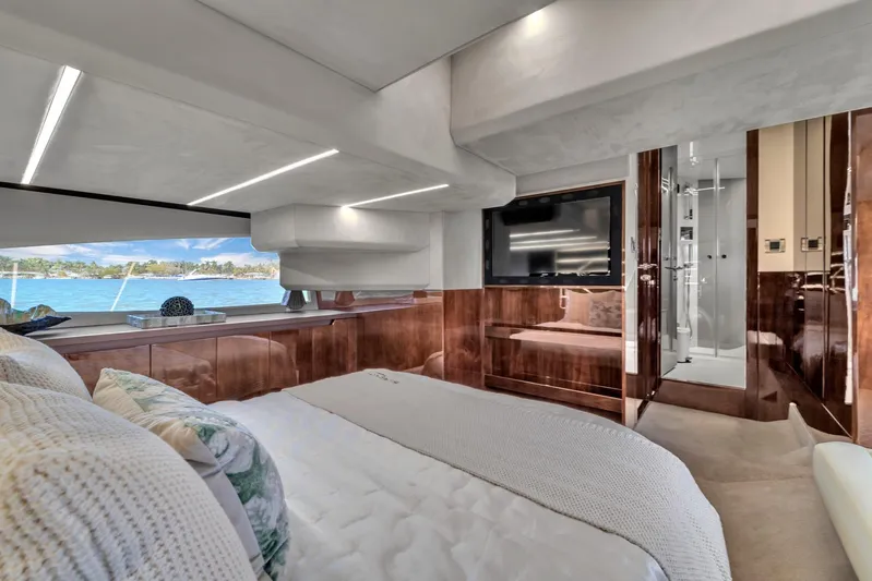  Yacht Photos Pics Luxurious interior of 2023 Galeon 425 HTS yacht with elegant wood finishes and scenic window view.