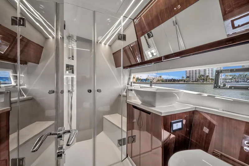  Yacht Photos Pics Luxurious bathroom interior of 2023 Galeon 425 HTS yacht with modern fixtures and waterfront view.