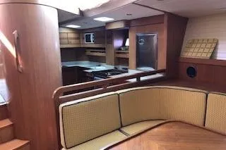 Sinfonie Sylt Yacht Photos Pics Interior of 2001 Grand Soleil 70 yacht with wood finish and cozy seating area.