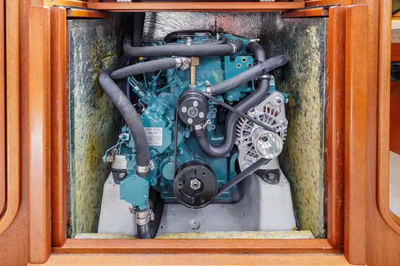 Roniin Yacht Photos Pics Engine compartment of a 2003 Hallberg-Rassy HR31 sailboat, showcasing detailed mechanical components.