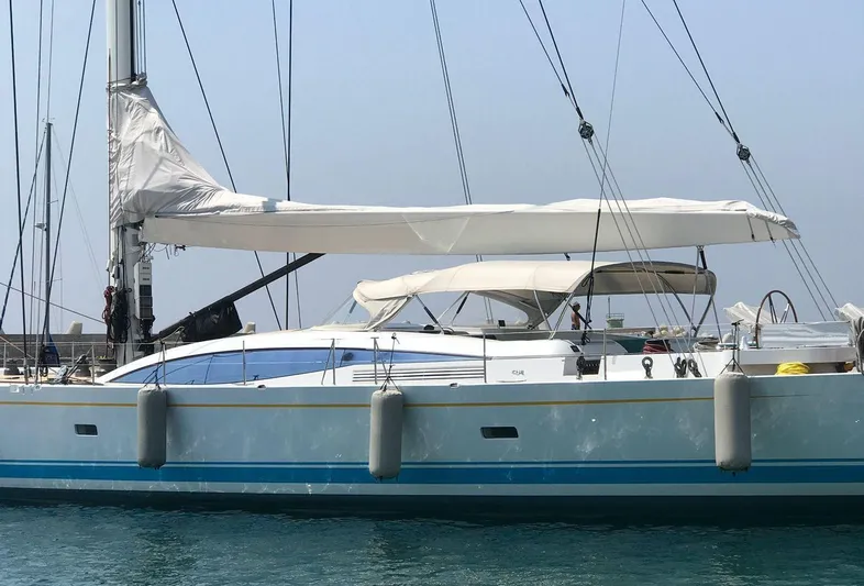  Yacht Photos Pics Sailing yacht CNB 117, 2006 model, docked with sails furled, in calm waters.