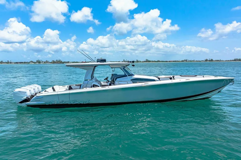 Rod's Jewel Yacht Photos Pics 2017 Nor-Tech 450SS boat on clear blue water under a sunny sky.