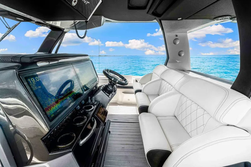 Rod's Jewel Yacht Photos Pics Interior of 2017 Nor-Tech 450SS boat with luxurious seating and advanced dashboard.
