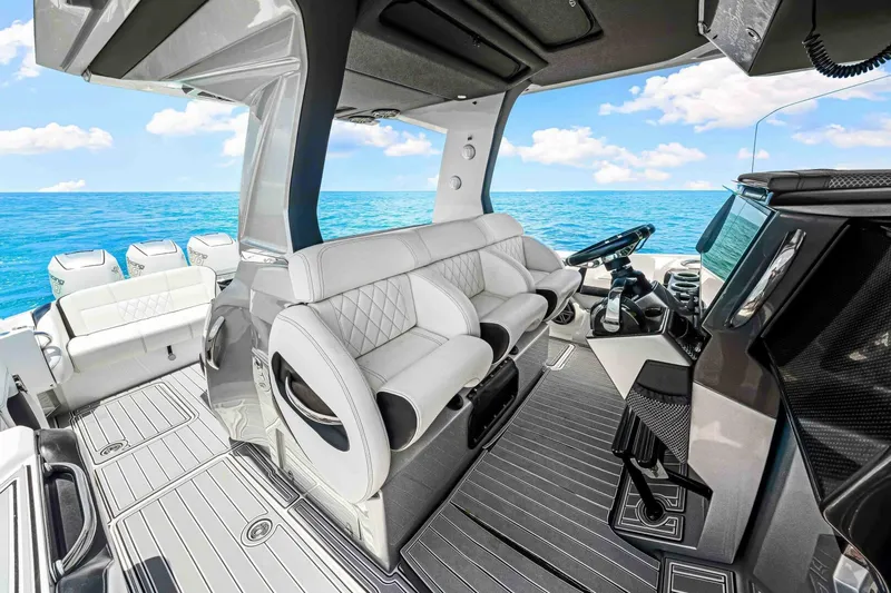 Rod's Jewel Yacht Photos Pics 2017 Nor-Tech 450SS boat interior with luxury seating and ocean view.