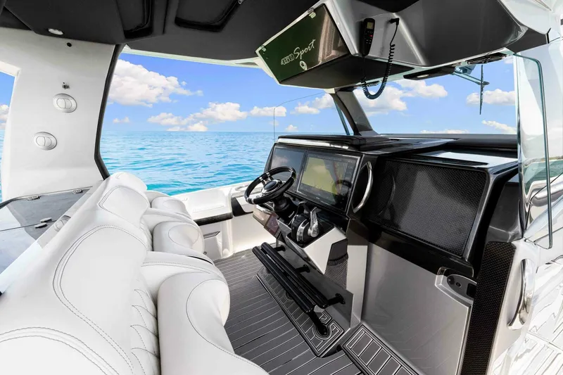 Rod's Jewel Yacht Photos Pics 2017 Nor-Tech 450SS boat interior with modern dashboard and ocean view.