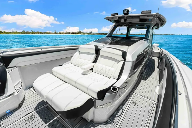 Rod's Jewel Yacht Photos Pics 2017 Nor-Tech 450SS luxury boat with white seating, cruising on clear blue waters.